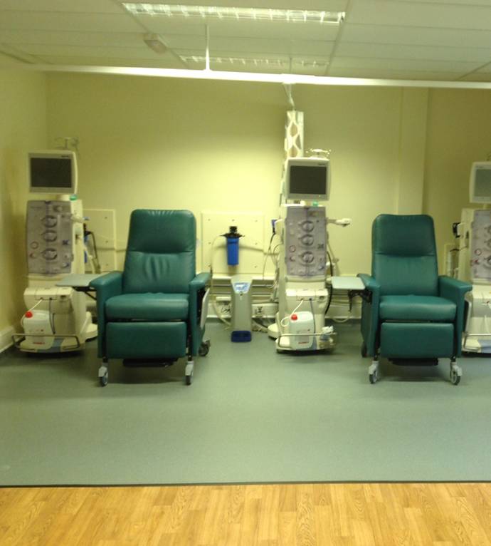 Image of clinic with dialysis machine and chair